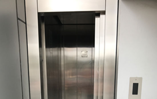 Geared traction elevators
