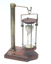 Nautical brass hanging sand timer with wooden base