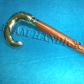 Wooden walking stick with brass crook handle
