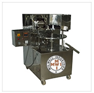 ROTARY FILLING AND SEALING MACHINE