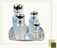 Set of 4 Sparkling white perfume bottles with silver plated tray