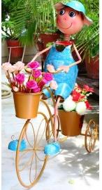 Boy on cycle with two pots planter for home, garden & balcony decor