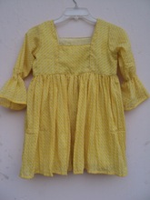 yellow color polka dot printed beautiful kids party wear dress