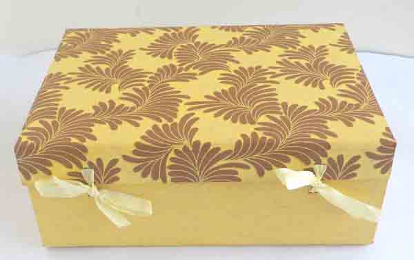 Yellow printed cotton paper with ribbons closure boxes