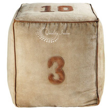 Fabric stuffed numeric design square shape pouf