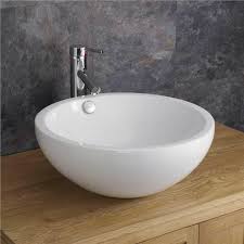 Non Polished Ceramic Round Shape Wash Basin, for Home, Hotel, Office, Restaurant, Style : Modern