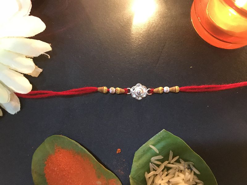 Cotton Silver rakhis, Feature : Beautiful Designs, Perfect Finishing, Shiny Look, Smooth Texture