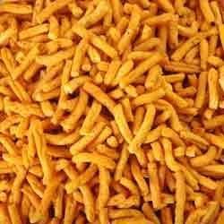 Yellow Tomato Sev Namkeen, for Snacks, Taste : Spicy