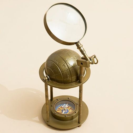 Magnifying Glass With Globe and Compass