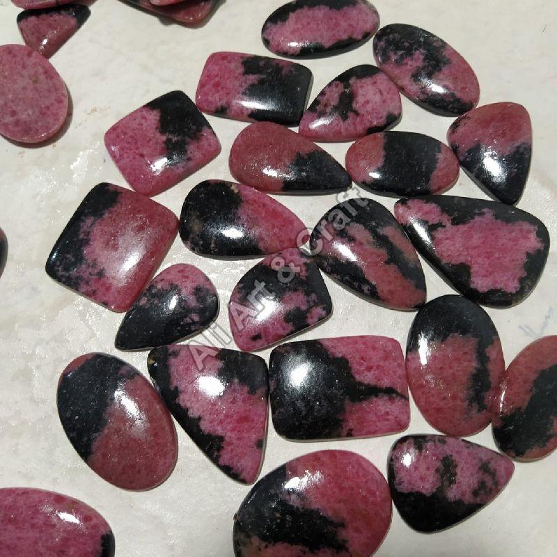 Polished Rhodonite Cabochon Gemstone, for Jewellery, Size : 0-10mm, 10-20mm, 20-30mm