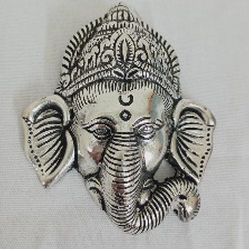 Silver Metal Ganesh Ji Face Artifact, for Interior Decor, Office, Home, Packaging Type : Box