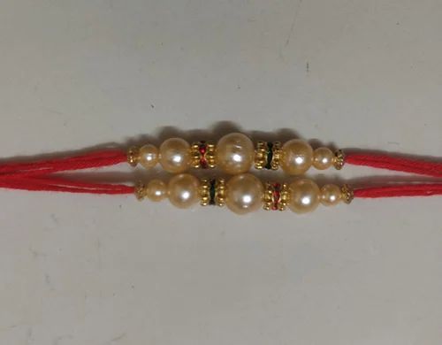Cotton Thread Colour Beads Rakhi, Feature : Beautiful Designs, Shiny Look, Smooth Texture