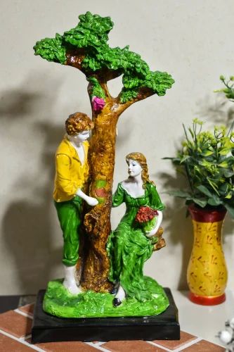 Polyresin Couple Standing Tree Statue, for Interior Decor, Speciality : Attractive Look, Nice Finish