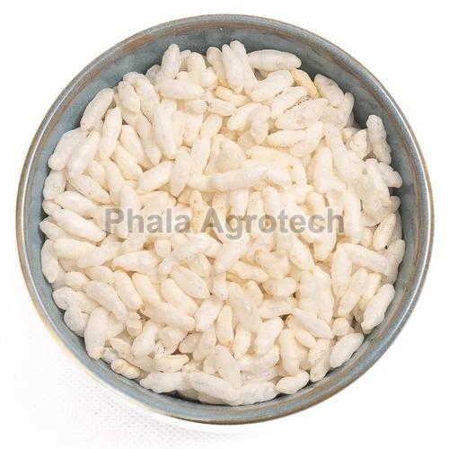 White Crunchy Plain Puffed Rice, for Cooking, Eating, Packaging Type : Plastic Packet