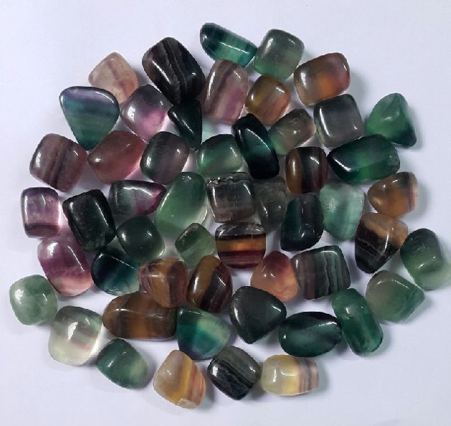 Polished Multi Fluorite Tumbled Stones, Feature : Aptivating Look, Attractive Look