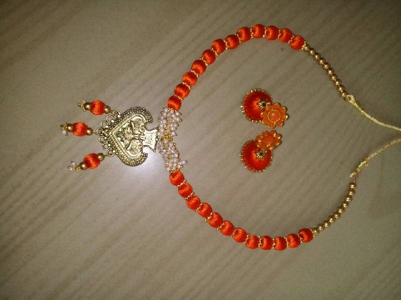 Orange color silk thread necklace with earrings