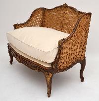 carved cane sofa