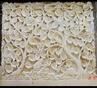 carved stone wall panel