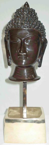 Antique buddha face sculpture