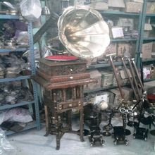 Antique carved gramophones on stand
