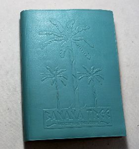goat leather with banana tree embossed on the front .