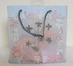 matching embroidery all over organza fabric bag