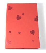 red paper cover travel notebook