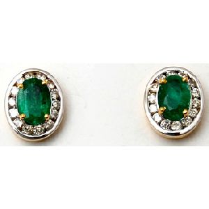 diamond studded emerald centered oval earrings