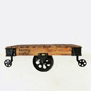 CAST IRON MANGO WOOD TOP MOVABLE WHEEL COFFEE TABLE