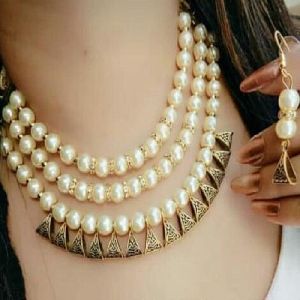 Ankur glimmery three string gold oxodize and white beads necklace set for women