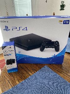 Sony PlayStation 4 Slim 1TB Console - BRAND NEW. Comes With Dual Charging Dock
