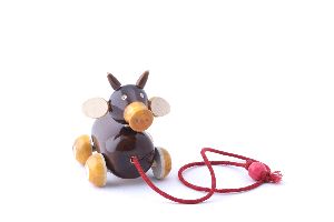 wooden pull along cow toy