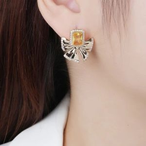 Topaz Studs Woman Earrings, Color : Yellow