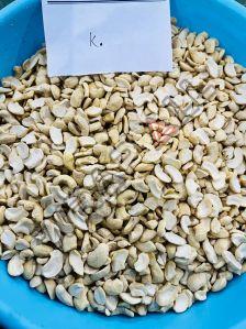 K Grade Split Cashew Nuts, Taste : Light Sweet For Human Consumption