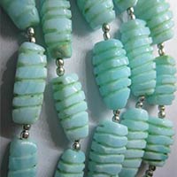 13 Inch Peru Opal Carved Twisted Beads