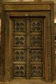Antique carved wooden Door with metal fittings and frame