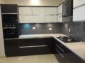 Lacquered Glass L Shaped Modular Kitchen