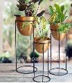Metal plant stand with plant pot