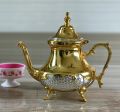 Round gold embossed brass teapot
